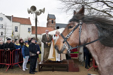 A priest blesses horses that will be ridden during the annual Goose Riding (Goose Pulling) festival which is held on Shrove Tuesday and involves a horse back rider trying to pull the head of a dead go...
