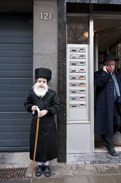 A Jewish boy disguised as an elderly Orthodox man to celebrate the festival of Purim when it is traditional to dress up.