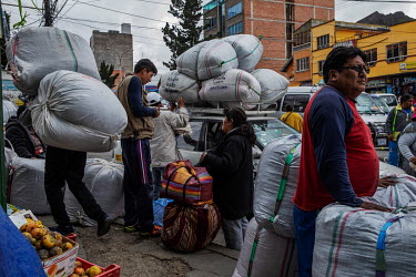 Coca farmers (cocaleros) and traders load their cars with sacks of coca leaves outside Villa Fatima's legal coca market in La Paz.Former President and former coca farmer Evo Morales, forced the Americ...