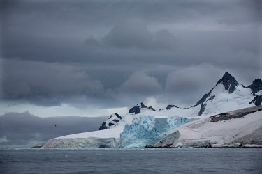 Thick ice covers islands in the Errera Channel.  The Greenpeace ship Artic Sunrise was in the Antarctic on the last stage of a pole to pole voyage from the Arctic to the Antarctic to investigate and d...