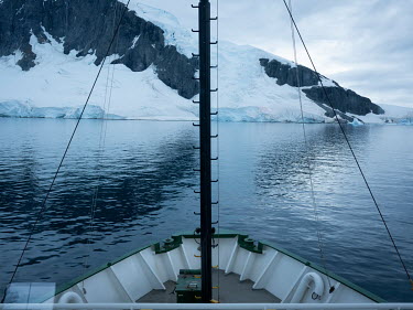 The bow of the Greenpeace ship, Arctic Sunrise in the Errera Channel.  The Greenpeace ship Artic Sunrise was in the Antarctic on the last stage of a pole to pole voyage from the Arctic to the Antarcti...