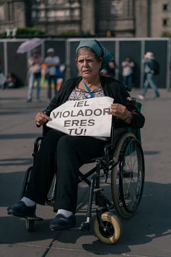 Maria Marquez (60) in the Zocalo Plaza during a protest on International Women's Day. ''For me, being a woman is the best, a woman is worth gold.'' ''I came to the march to fight for my people.''