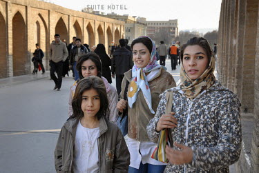 A group of young women cross the Zayandeh River via the Allahverdi Khan Bridge (Si-o-se-pol).