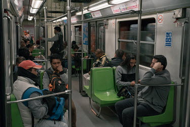 Male passengers ride a metro train during the national women's strike, 'A Day Without Women'. Thousands of women across Mexico went on strike after an unprecedented number of women attended a protest...