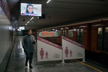 A female passenger leaves an empty women and children's section in a metro station during the national women's strike, 'A Day Without Women'. Thousands of women across Mexico went on strike after an u...
