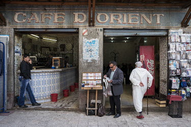 A man selling cigarettes outside the Cafe d'Orient in the casbah area.