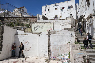 Children play in the remains of buildings in the casbah area that have collapsed due to neglect.