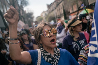 A woman shouts slogans during a protest on International Women's Day. The annual demonstrationÂ�intensified and turned into a bigger movementÂ�against gender-based violenceÂ�amid an increase in kil...