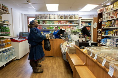 Indigenous Nenet, Mikhail, shopping in a store at the Gazprom Bovanenkovo gas field. He has come to the site to sell fish to the facility's workers. He lives in a camp 30 km from Bovanenkovo and often...