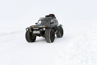 A TREKOL all-terrain vehicle travels on the 'zimnik' winter road that runs on the frozen Ob River connecting small villages with Salekhard, the administrative center of Yamal.Â�
