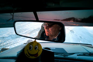 Mihail driving a TREKOL all-terrain vehicle. He travels from Arkhyz in the Caucasus Mountains each year to drive passengers and cargo in the vehicle on the 'zimnik' winter road that runs on the frozen...