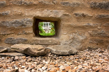 The hole in the garden wall of the Old Vicarage, part of the Kirtlington village 'Hedgehog Street', one a of many man-made routes built so the animals can negotiate human areas.