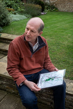 Chris Powles, the man behind the Kirtlington village 'Hedgehog Street', one a of many man-made routes built so the animals can negotiate human areas, suveys the map of the network.