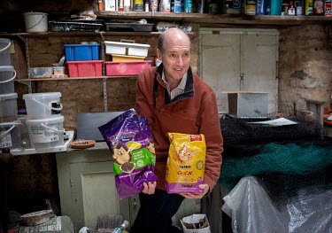 Chris Powles with packets of hedgehog food. He the man behind the Kirtlington village 'Hedgehog Street', one a of many man-made routes built so the animals can negotiate human areas.