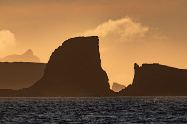 The sun sets over the South Shetland Islands near Greenwich Island.  The Greenpeace ship MY Esperanza is on the final leg of the pole to pole voyage from the Arctic to the Antarctic. The almost year...