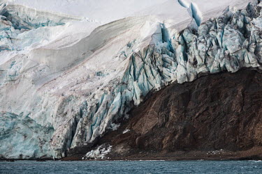 A glacier flows into Discovery Bay from Greenwich Island.  The Greenpeace ship MY Esperanza is on the final leg of the pole to pole voyage from the Arctic to the Antarctic. The almost year-long yova...
