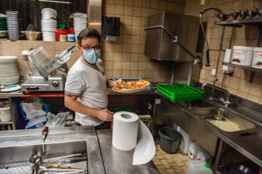 Andriulo alone in his restaurant's kitchen during Geneva's second lockdown during which restaurants have been permitted to stay open, but only for take away service. Andriulo has had to lay off his st...