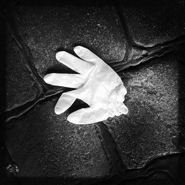 A discarded plastic glove, photographed on the streets of Berlin. Facemasks have become mandatory in public spaces in Germany in the course of the corona virus pandemic of 2020.