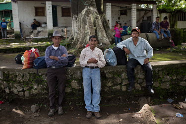 La Trinidad community elders Gervasio Lopez (left), 83, Jorge Ambrocio Garcia (centre), 63, and Ncolas Ramon Jimenez Montejo, 47, wait for army trucks to evacuate them. Originally from Huehuetenango,...
