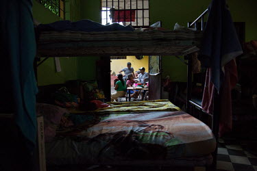 Community members from La Trinidad gather at a hallway inside the Jose Marti Federation school, current shelter for the Fuego Volcano-affected community members since 4 June 2018, a day after the disa...