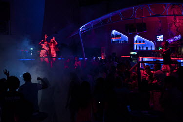 People dancing at a nightclub.