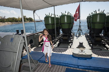A girl visiting the Nusret, an Ottoman Navy ship that served as a mine layer during the Gallipoli Campaign and is now a museum ship.