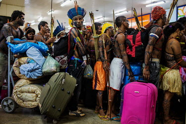 Munduruku Indians line up to board a plane at Altamira Airport after protesting against the construction of the Belo Monte Dam on the Xingu River. The Mundurukus inhabit the banks of the Tapajos River...