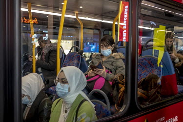 Bus passengers during rush hour in central London.