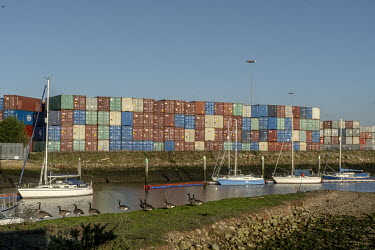 Containers stacked by the river Orwell near the port of Felixstowe. A combination of stockpiling for Brexit and the effects on trade of the COVID-19 crisis have meant that many ports are overloaded.