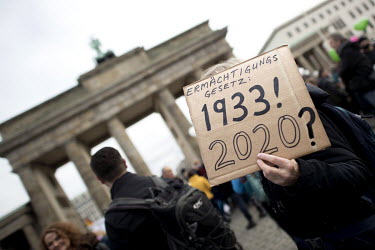 A protester holds a placard that reads: 'Ermaechtigungsgesetz 1933! 2020?' (Authorization Act 1933 2020) during a protest against lockdown measures and other government policies relating to the novel...