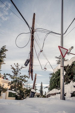 An electricity pole dramatically damaged and hanging from the power wires as about 45 cm of snow covers the ground in the northwest outskirts of the city after it was was hit by Filomena, the stronges...