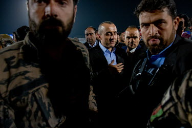 Amrullah Saleh, Vice-President of Afghanistan, former interior minister and National Security Director, surrounded by security officers at a football match where he was due to present a trophy to the...