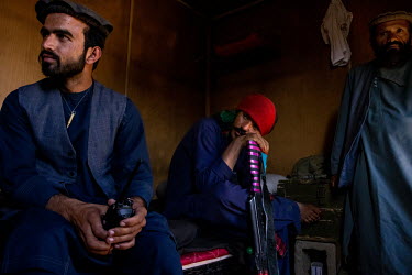 Police officers in a bunker on the frontline where they are regularly attacked by Taliban militants.