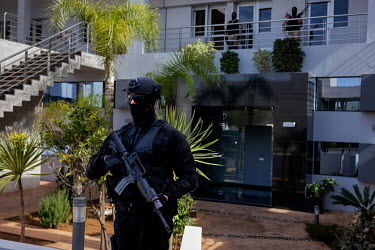A heavily armed guard outside the Bureau Center d'Investigation Judiciaire, which deals with cases of Islamised terrorism.