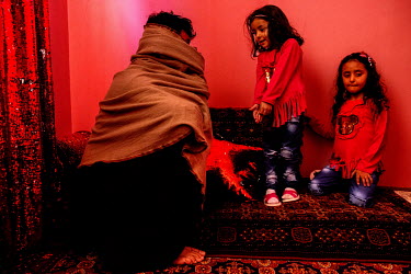A former Taliban militant with his children. The insurgent was released from prison following an agreement between the American government and the Taliban.