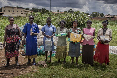 A group of women belonging to the Lakula Group Banda Plastics group with items of resellable plastic waste that they have recovered from an illegal rubbish dump in Banda.