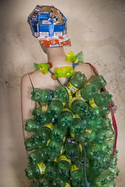Clothes made from waste plastic bottles are worn on a mannequin in the studio of Gisa Jr Gong Brian, an artist who creates, along with members of his group Afrika Arts Kollective, pieces from waste: c...