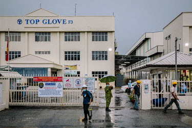 Top Glove employees finishing their shift at a factory. Malaysian authorities lifted a month-long lockdown on dormitories housing Top Glove workers on 14 December 2020 even as the firm reported the fi...