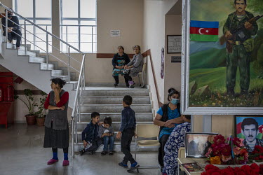 Women and children gather in the hallway of a school in the city of Barda that has been turned in to a shelter for people who have been displaced by fighting in the frontline towns and villages around...
