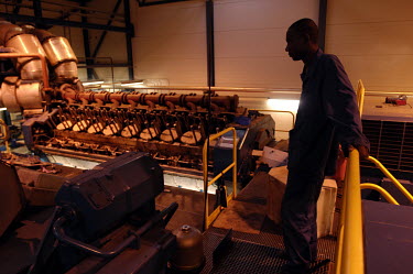 A STEE employee (Chadian National Electric Company) inspects the machinery at what is the capital city's most modern power station.