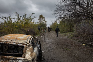 Azerbaijani police walk through the destroyed and abandoned town of Fuzuli, once home to more than 26,000 people. The Fizuli region of Azerbaijan was occupied by Armenia in 1988 and was recaptured by...