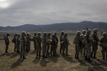 Azerbaijani soldiers during a training exercise on a base near the frontline somewhere in central Azerbaijan. Many of the young men had already been fighting on the frontline and were on standby waiti...