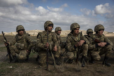 Azerbaijani soldiers during a training exercise on a base near the frontline somewhere in central Azerbaijan. Many of the young men had already been fighting on the frontline and were on standby waiti...