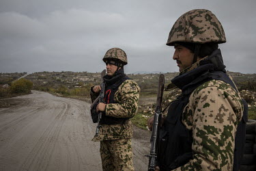 Azerbaijani soldiers and police man a checkpoint on a road outside the recently recaptured town of Fuzuli. Once rich agricultural land it was left in ruin after nearly 30 years of neglect under Armeni...