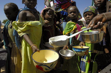 Children at the Gassile camp for internally displaced persons recieve a meal at the end of their classes. The food is supplied by the WFP (World Food Program) and cooked by the children's mothers. The...
