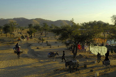 People water their donkeys near the Koloma camp for internally displaced persons.