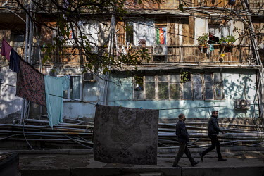 Rugs hang out to dry outside an old dormitory building complex in the Darnagul neighbourhood of Baku, now home to thousands of refugees from Nagorno Karabakh.