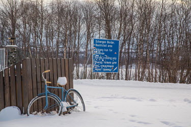 A sign at the Arctic border crossing between Russia and Norway. This is the northernmost crossing point and marks the end of the Schengen area. An old rule forbids pedestrians from crossing the border...