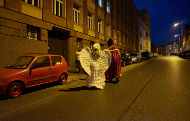 People dressed as a devil, an angel and St. Nicholas walk the streets during the Mikulas (St. Nicholas) celebration on the Republic Square (Namesti republiky). St. Nicholas is a long Czech tradition,...