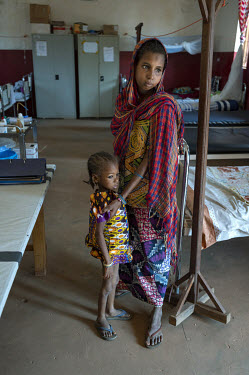 A mother and her child at a hospital where the child is being treated for malnourishment.